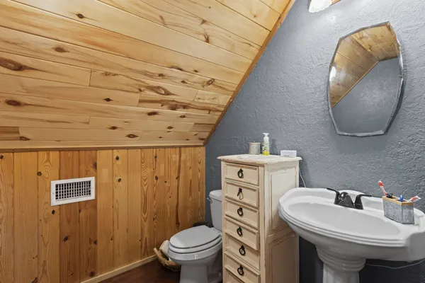 a bathroom with a sink and a toilet