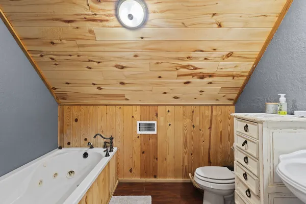 a bathroom with a shower and a window