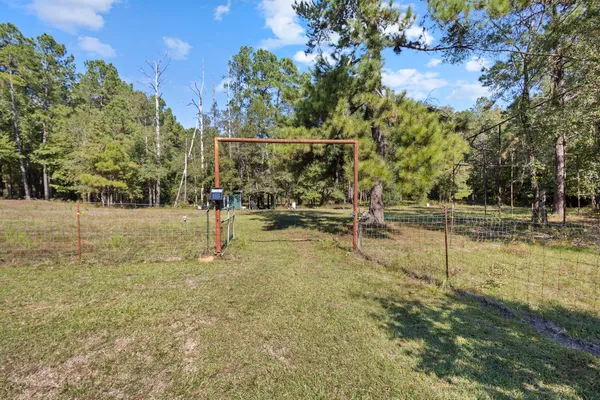 a view of outdoor space with trees all around