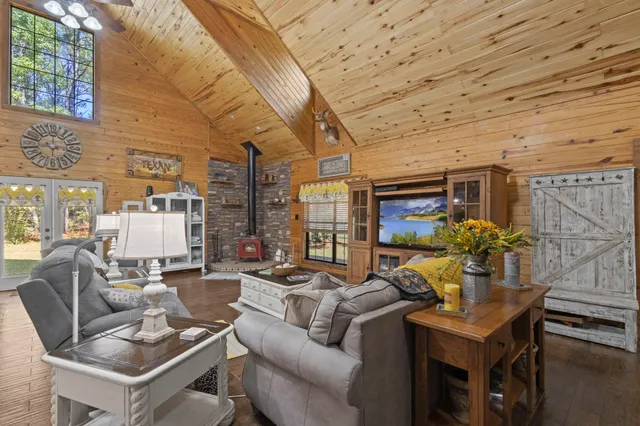 a living room with furniture and flowers