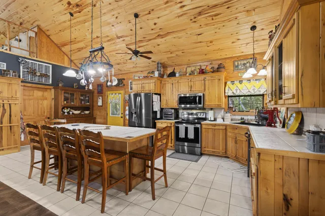 a view of a dining room with furniture and window