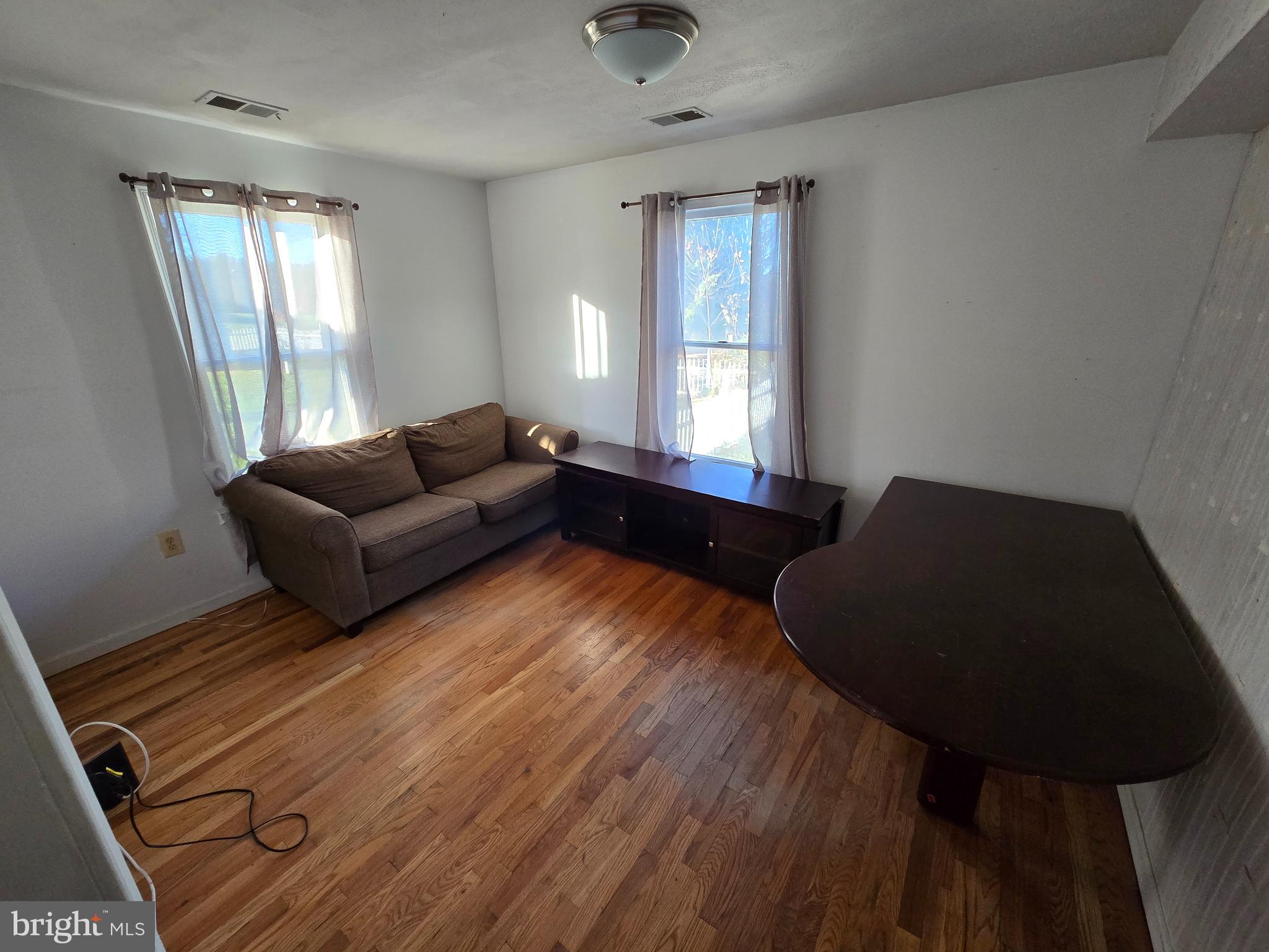 2621 Braddock Road Mount Airy, MD 21771 - Photo 11 of 15 a living room with furniture and a window
