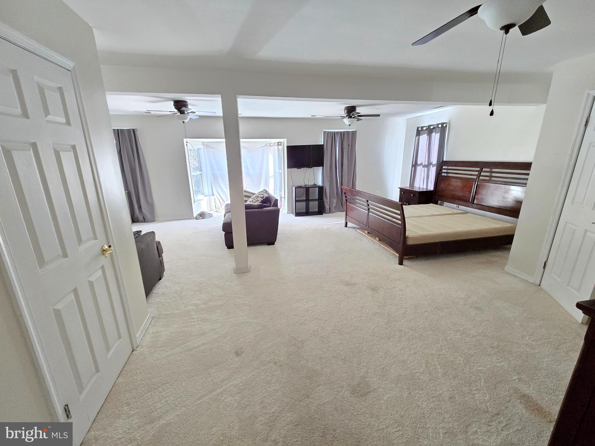 2621 Braddock Road Mount Airy, MD 21771 - Photo 12 of 15 a living room with furniture and a flat screen tv