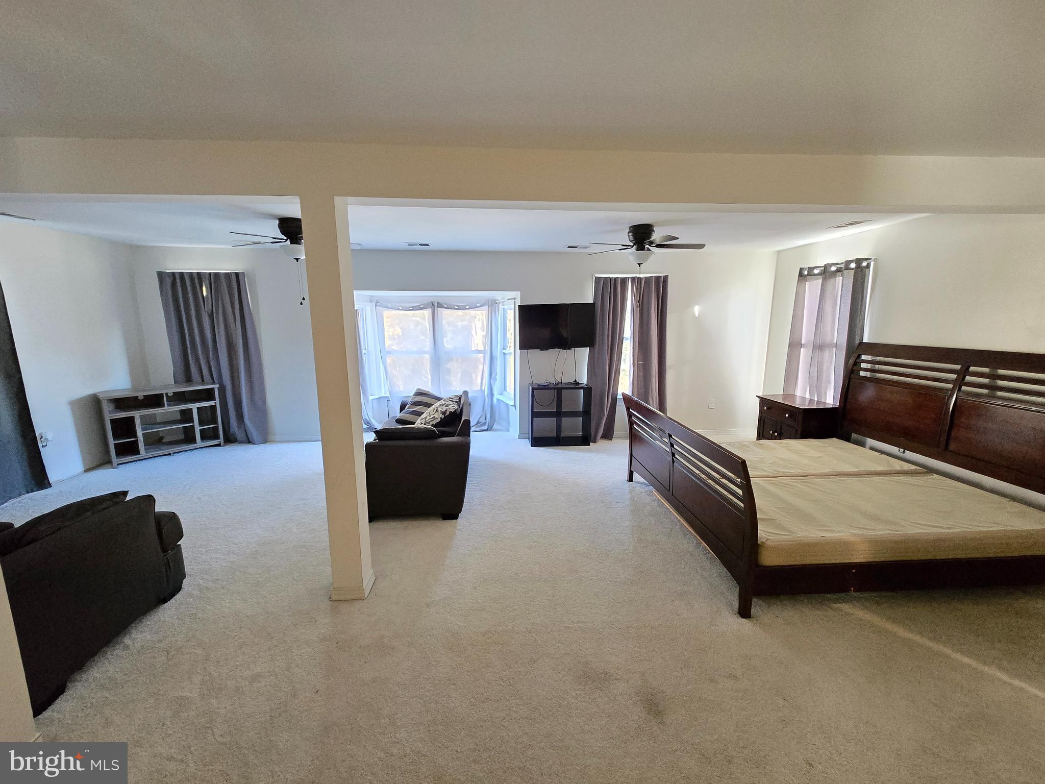 2621 Braddock Road Mount Airy, MD 21771 - Photo 15 of 15 a living room with furniture and a flat screen tv