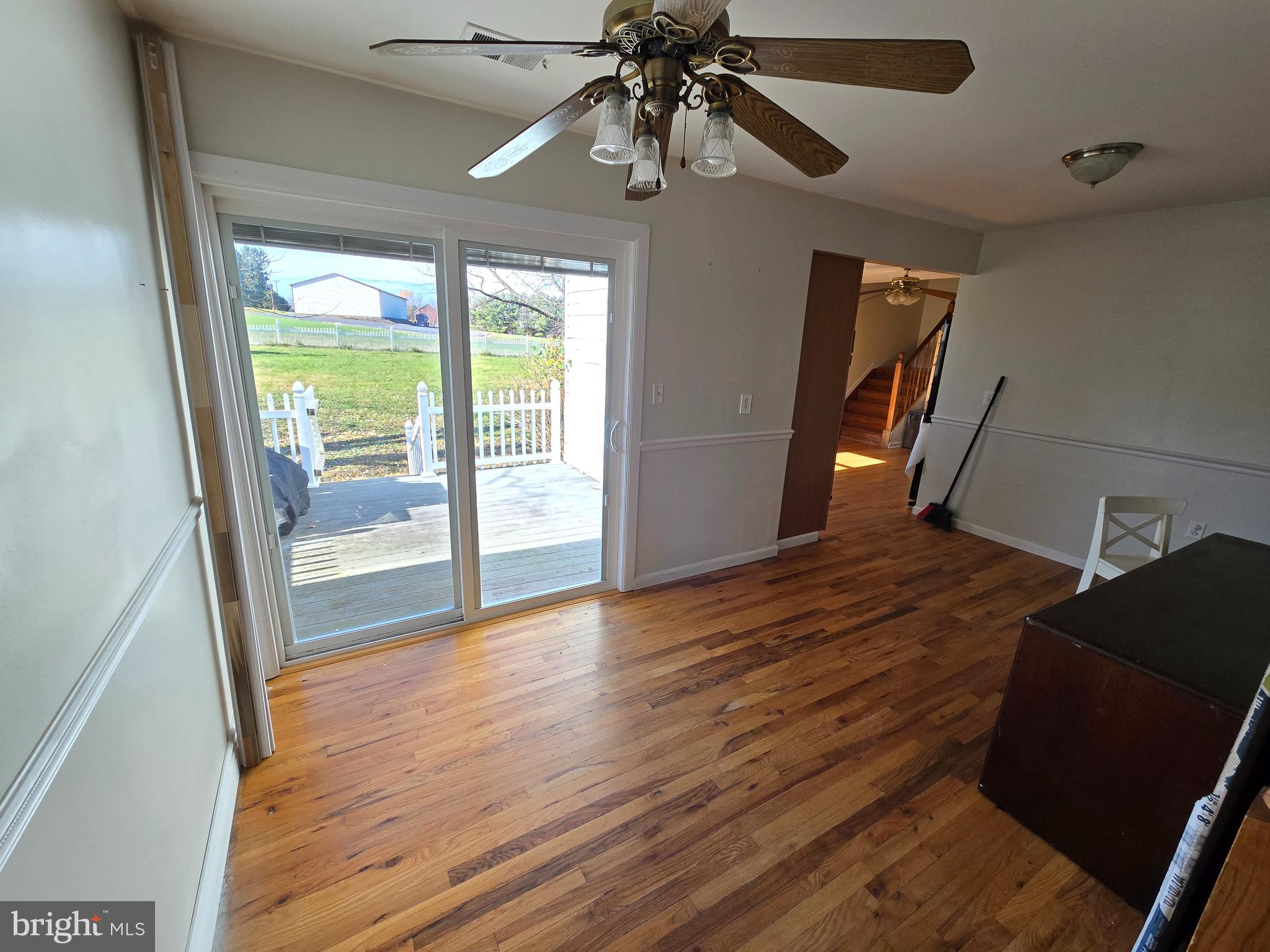 2621 Braddock Road Mount Airy, MD 21771 - Photo 10 of 15 a view of an empty room with wooden floor and a window