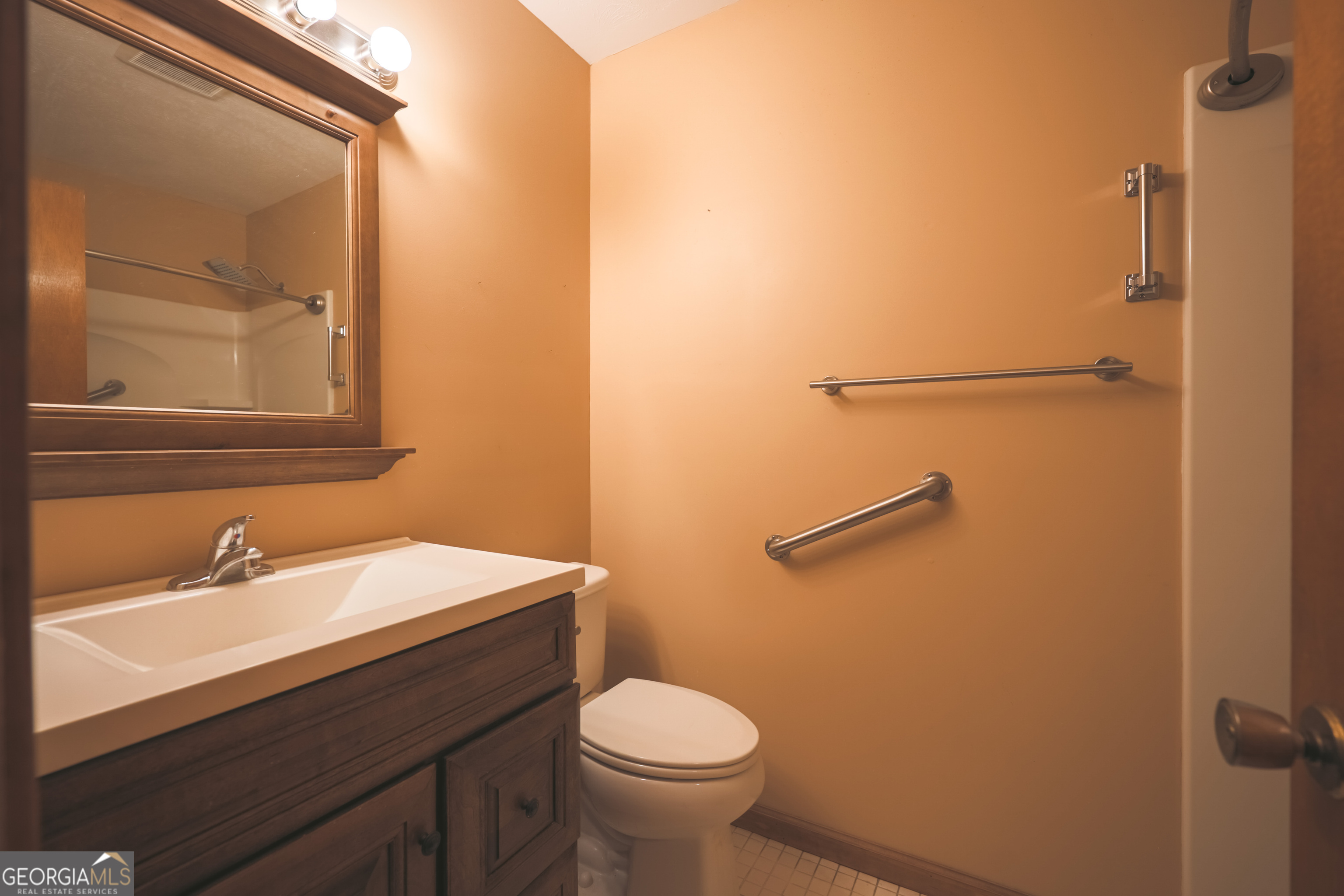 3111 Spatola Loop Blackshear, GA 31516 - Photo 14 of 23 a bathroom with a sink a toilet and shower