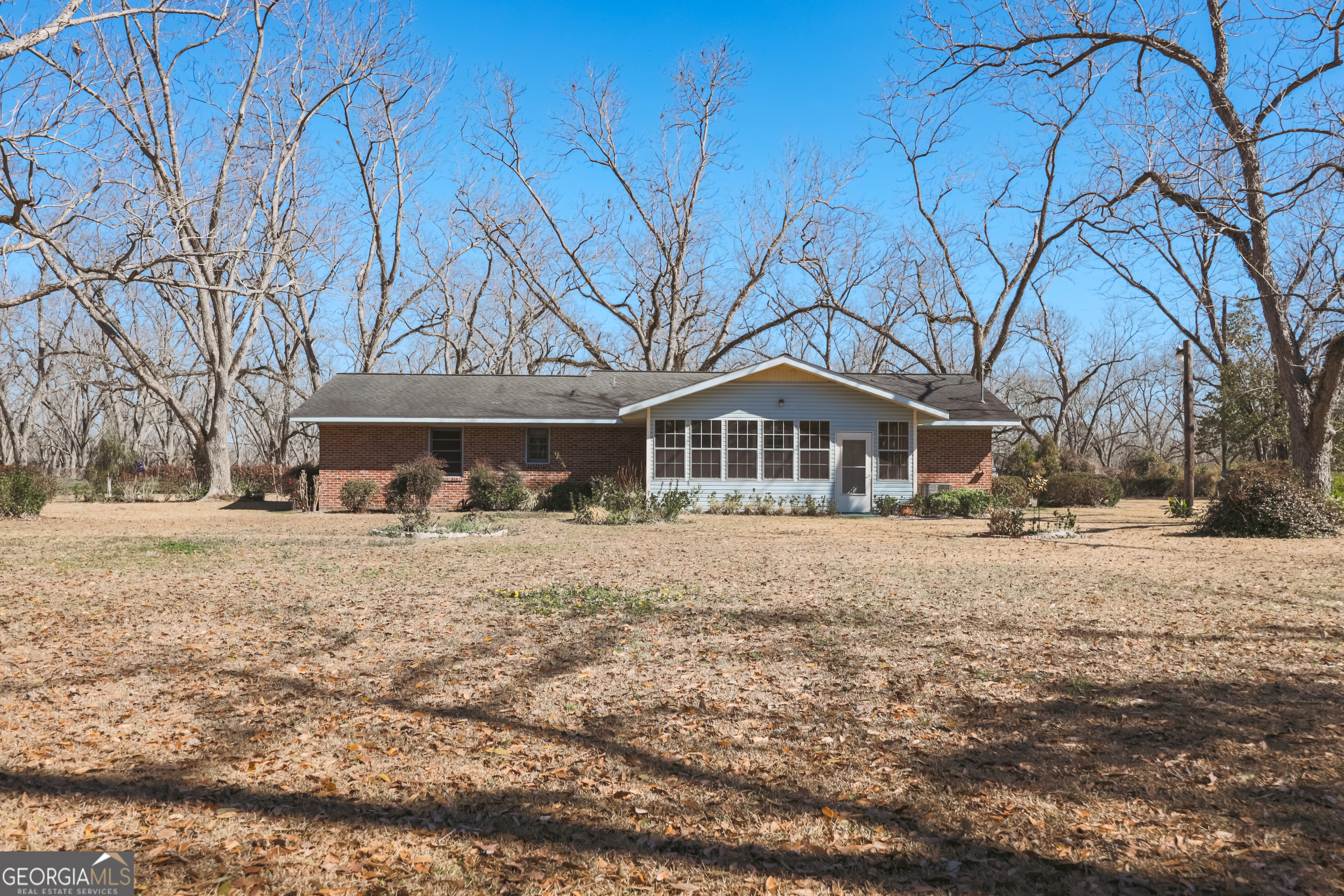 3111 Spatola Loop Blackshear, GA 31516 - Photo 4 of 23 a front view of a house with a yard