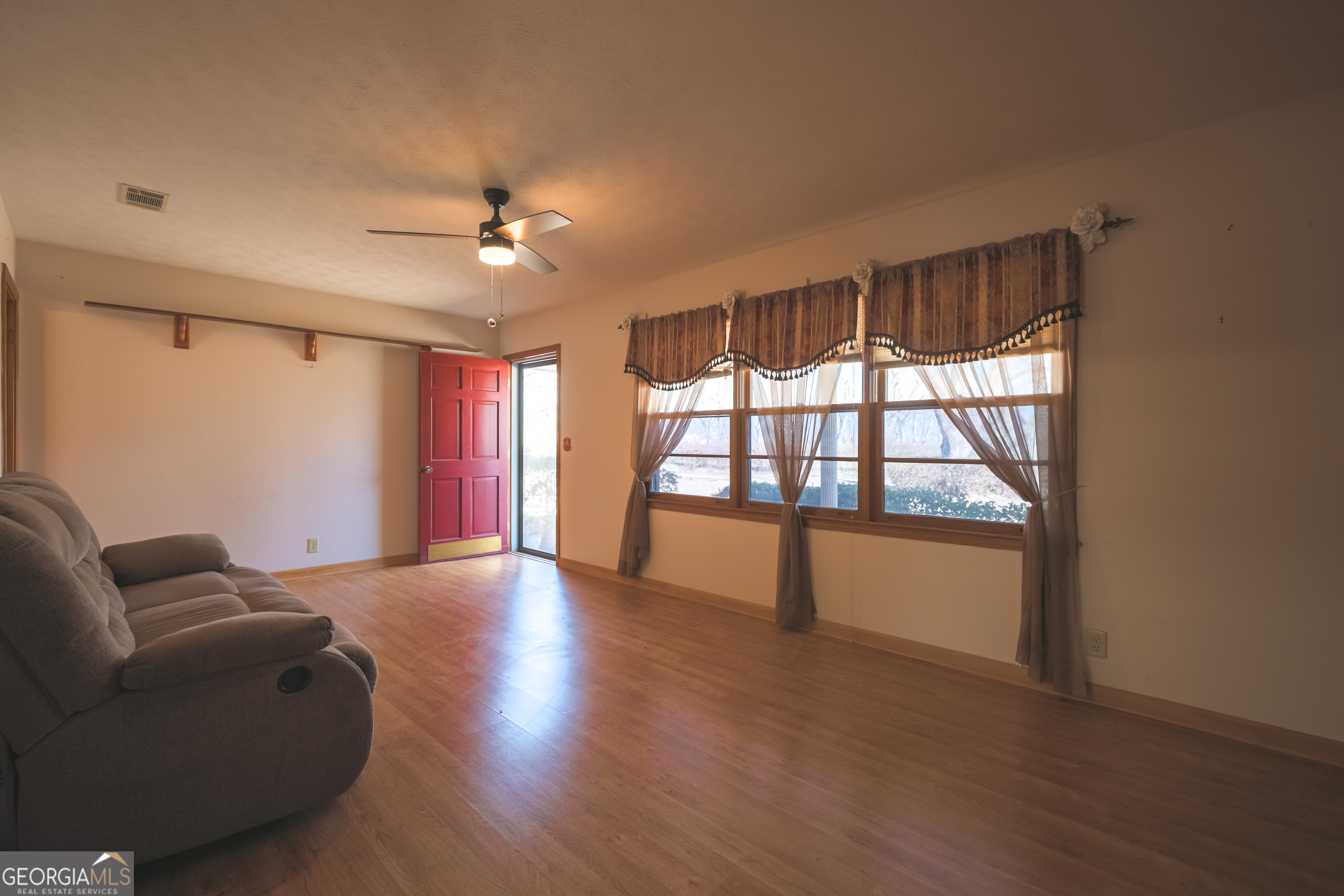 3111 Spatola Loop Blackshear, GA 31516 - Photo 8 of 23 a living room with furniture and a large window