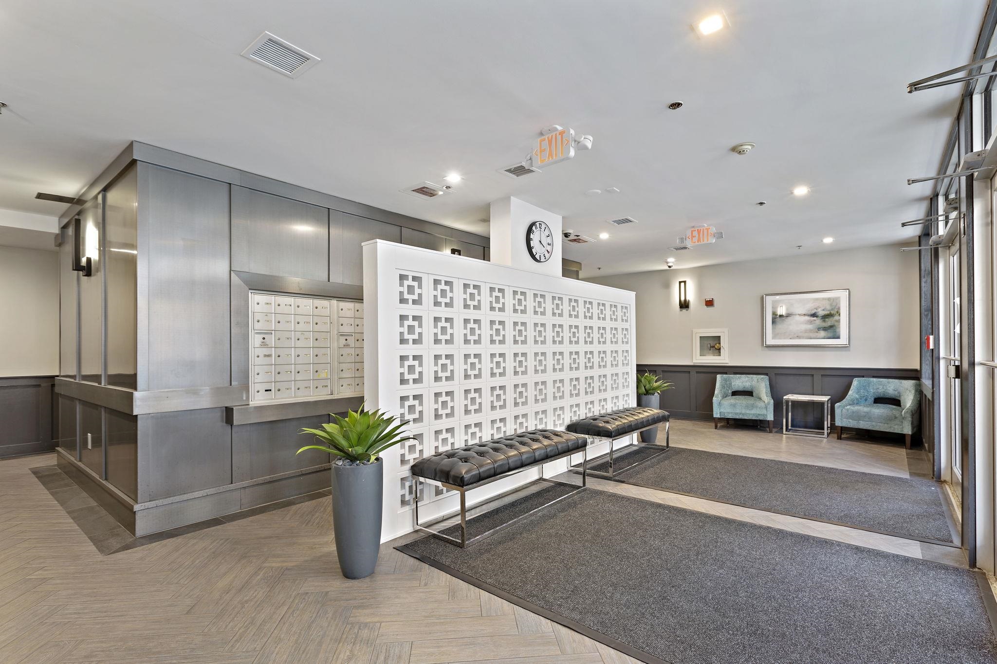 501 9th Street, Unit 309 Hoboken, NJ 07030 - Photo 17 of 18 a lobby with furniture and a potted plant