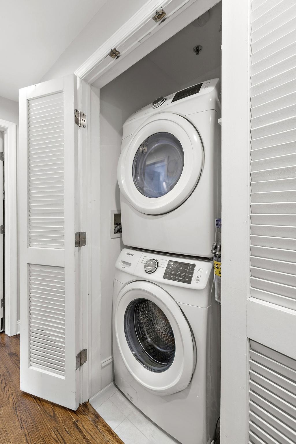 501 9th Street, Unit 309 Hoboken, NJ 07030 - Photo 8 of 18 a utility room with dryer and washer