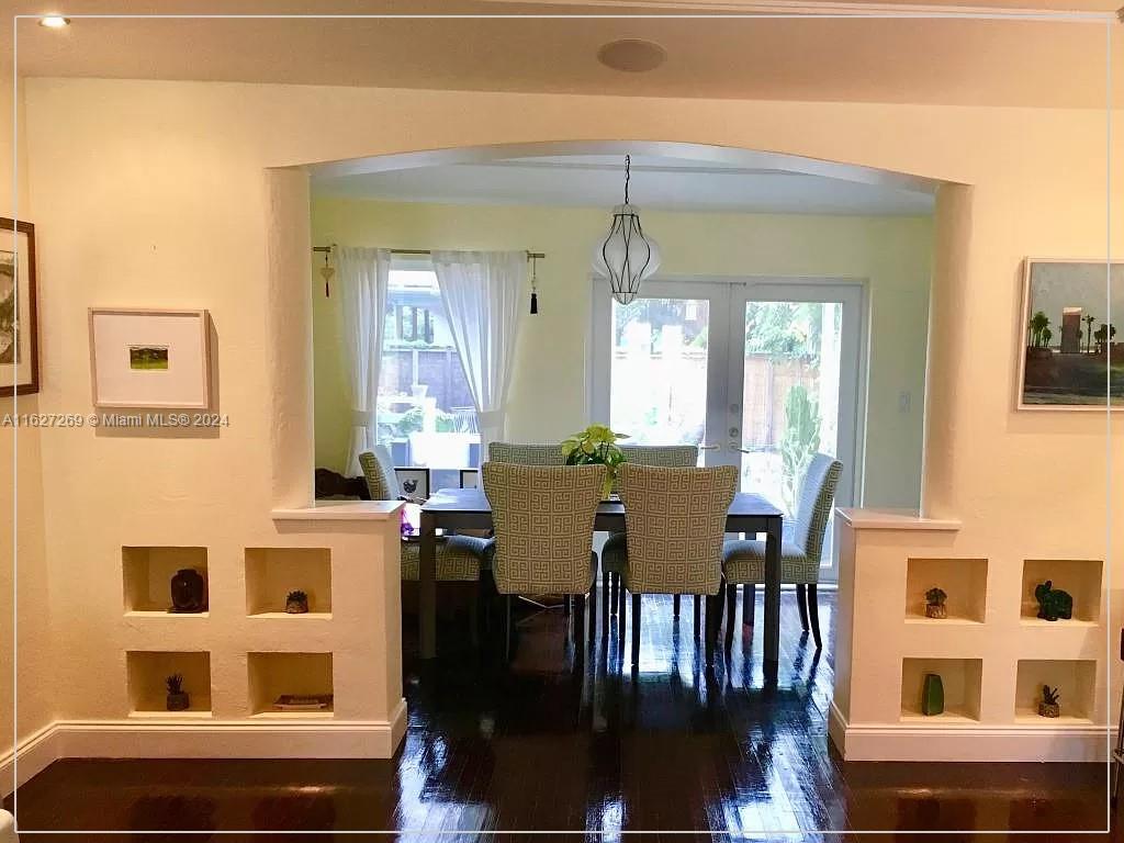 8818 Abbott Avenue Surfside, FL 33154 - Photo 11 of 28 a view of a dining room with furniture and chandelier