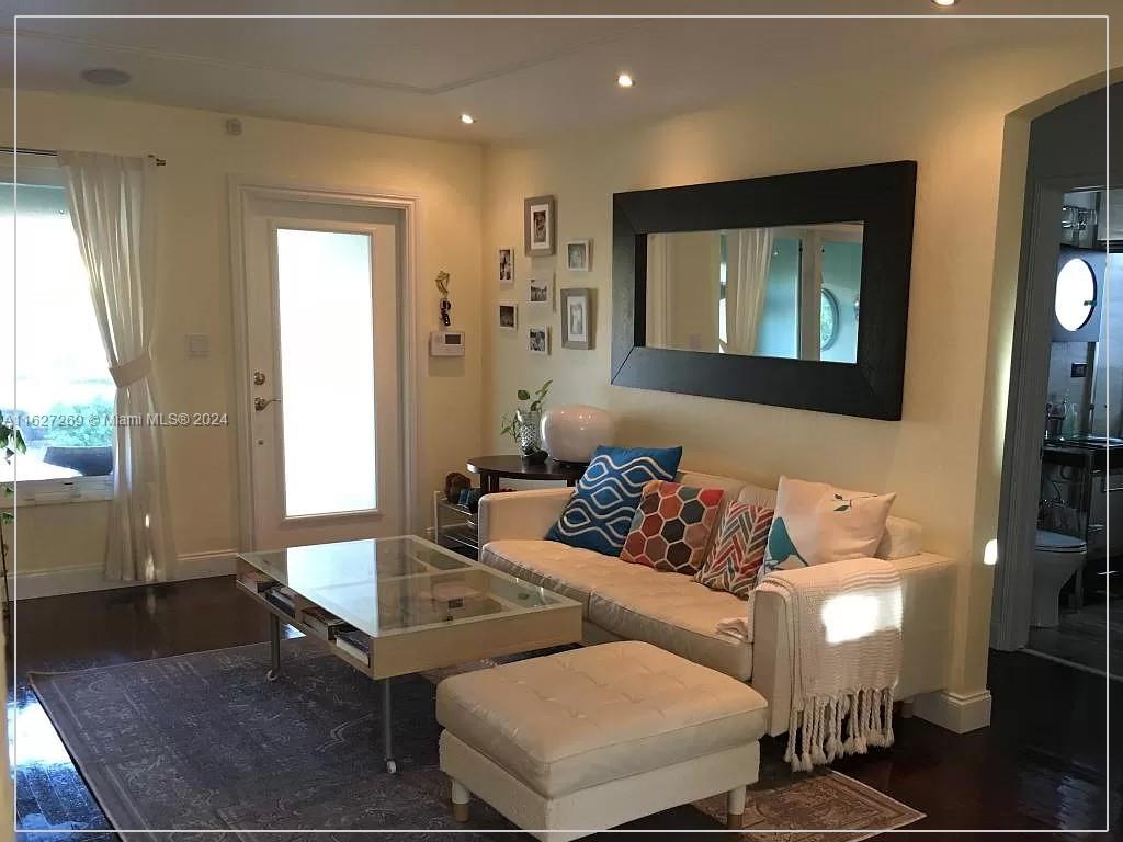 8818 Abbott Avenue Surfside, FL 33154 - Photo 7 of 28 a living room with furniture and a window