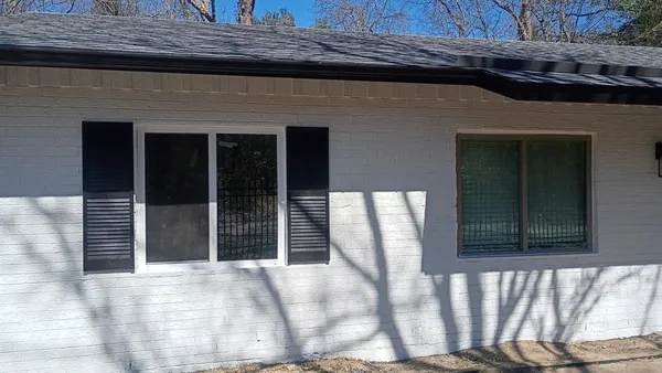 a front view of a house with a large window