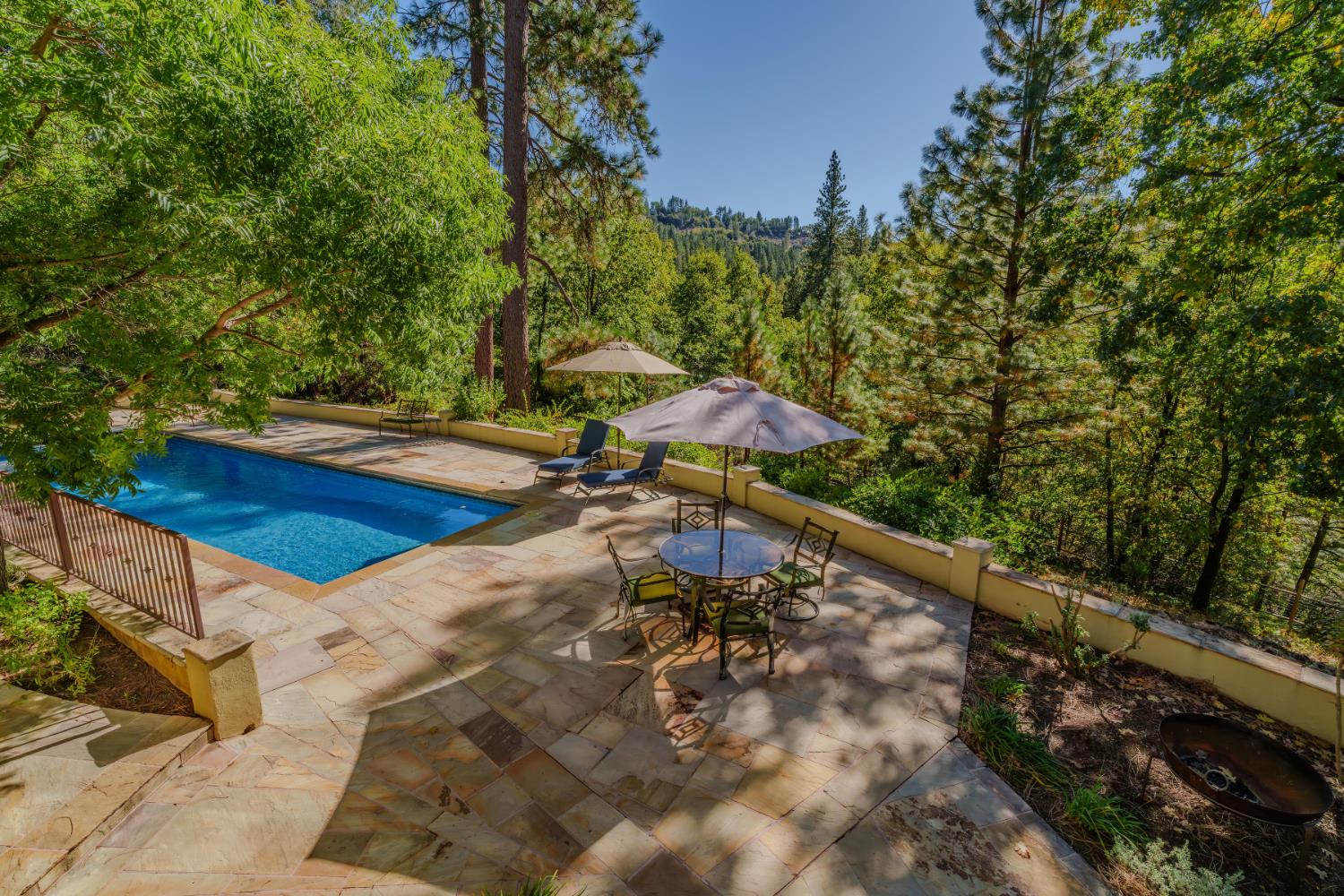4581 Highway 4 Murphys, CA 95247 - Photo 20 of 58 a view of a swimming pool with an outdoor space and seating area