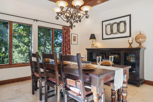 a spacious bathroom with a tub sink and mirror