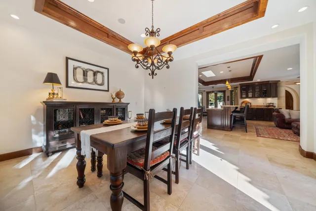 a spacious bathroom with a granite countertop sink and a large mirror
