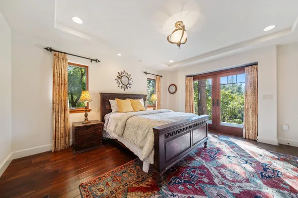 a kitchen with stainless steel appliances granite countertop wooden floors and sink