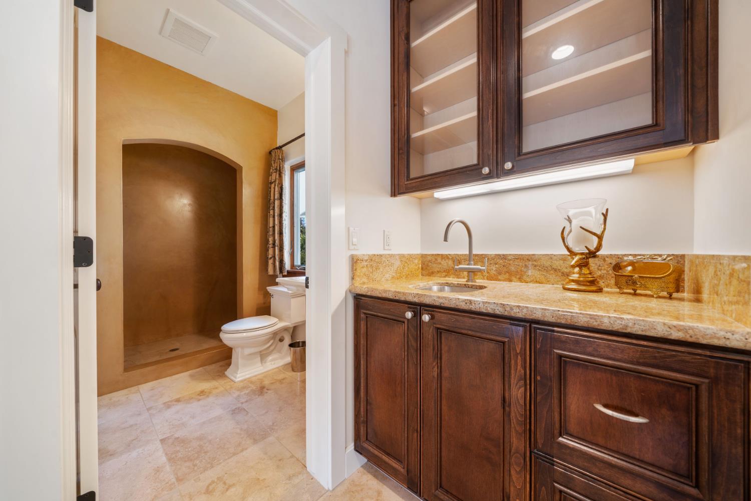 4581 Highway 4 Murphys, CA 95247 - Photo 41 of 65 a bathroom with a sink a toilet and a mirror