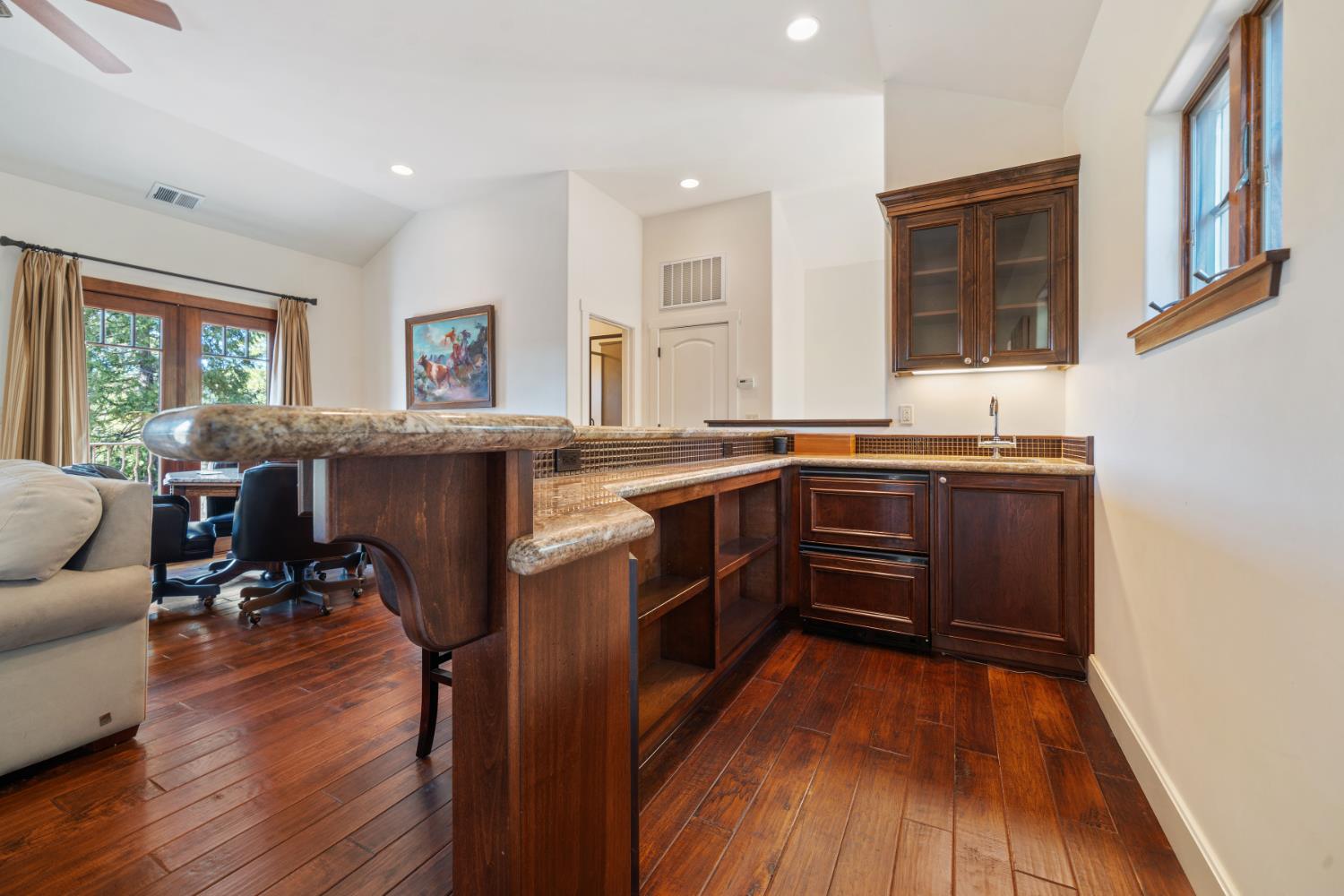 4581 Highway 4 Murphys, CA 95247 - Photo 47 of 65 a kitchen with stainless steel appliances granite countertop wooden floors and sink