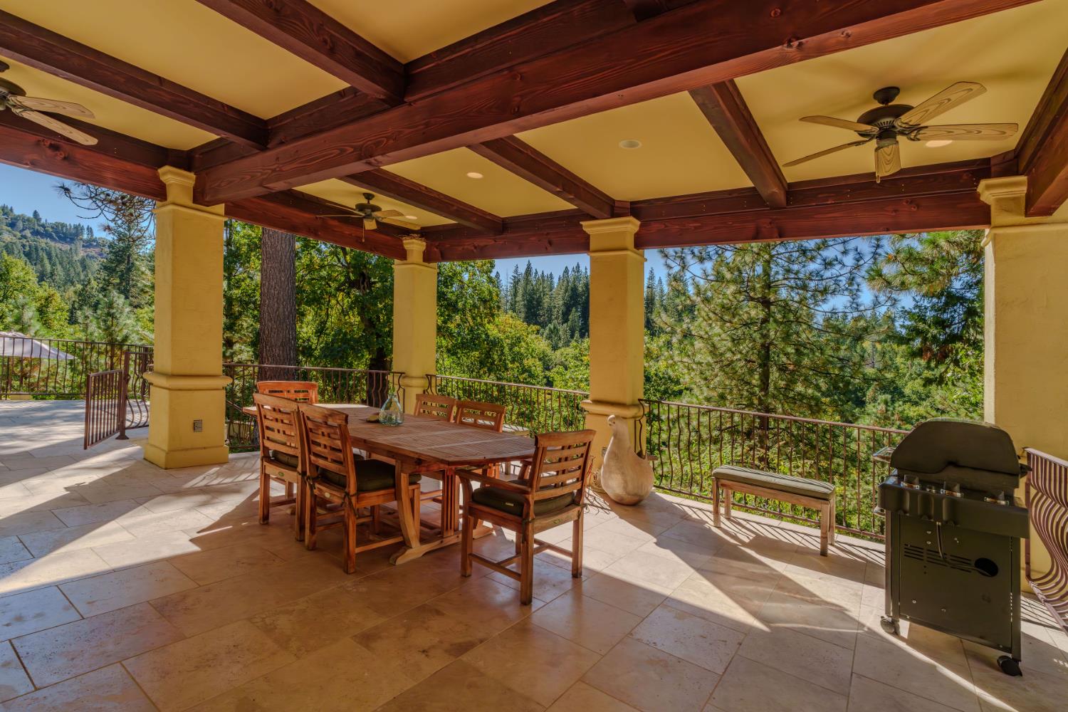 4581 Highway 4 Murphys, CA 95247 - Photo 49 of 65 a view of a patio with a table chairs and a small yard