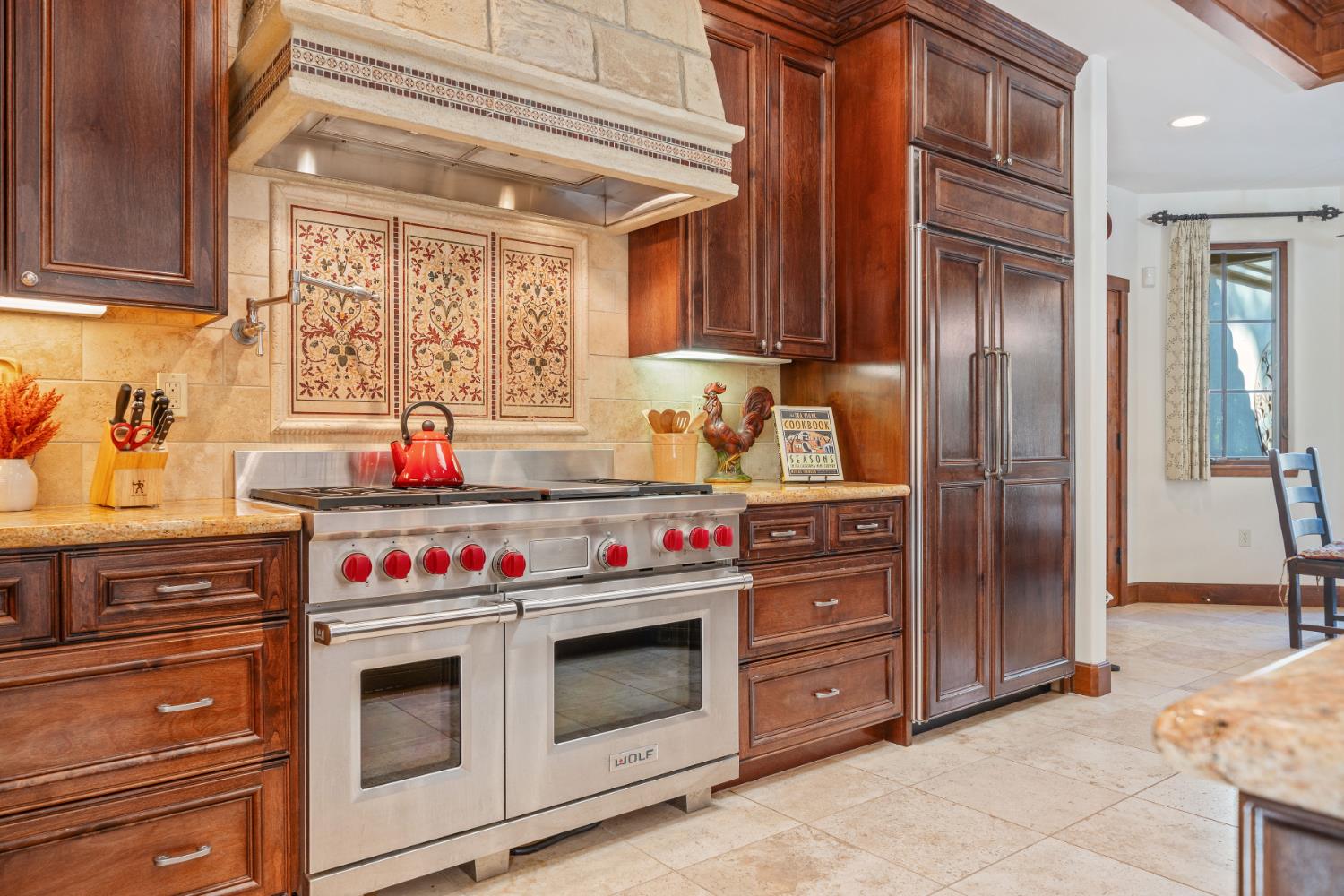 4581 Highway 4 Murphys, CA 95247 - Photo 9 of 58 a kitchen with stainless steel appliances granite countertop a stove and a refrigerator