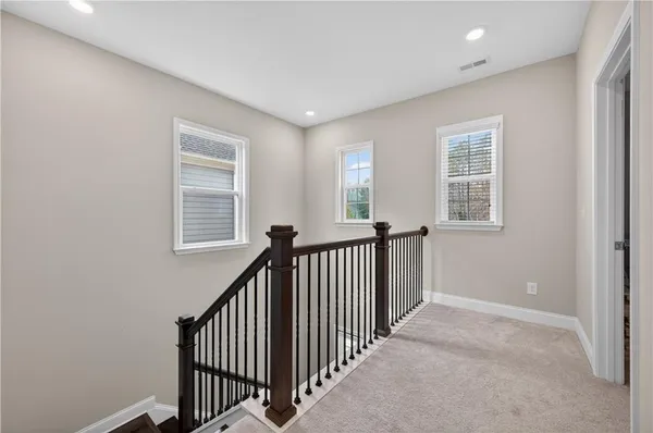 a view of hallway with windows