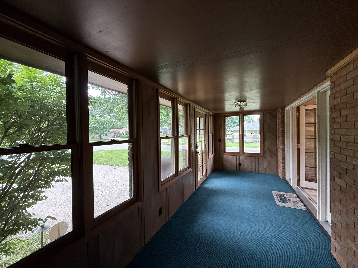 1048 Warren Street Henry, IL 61537 - Photo 22 of 26 a view of hallway with a large window and wooden floor