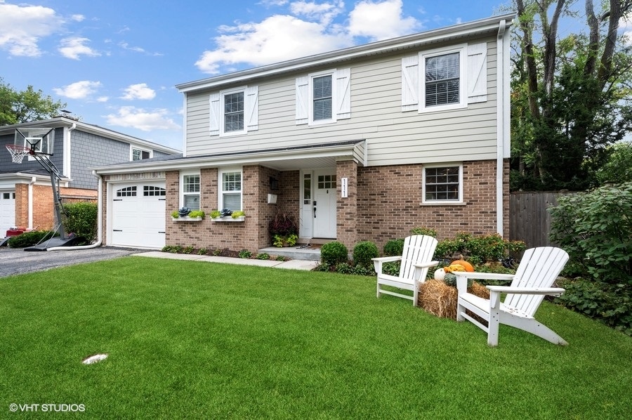 111 Riverside Drive Northfield, IL 60093 - Photo 1 of 33 a view of a house with a yard and sitting area