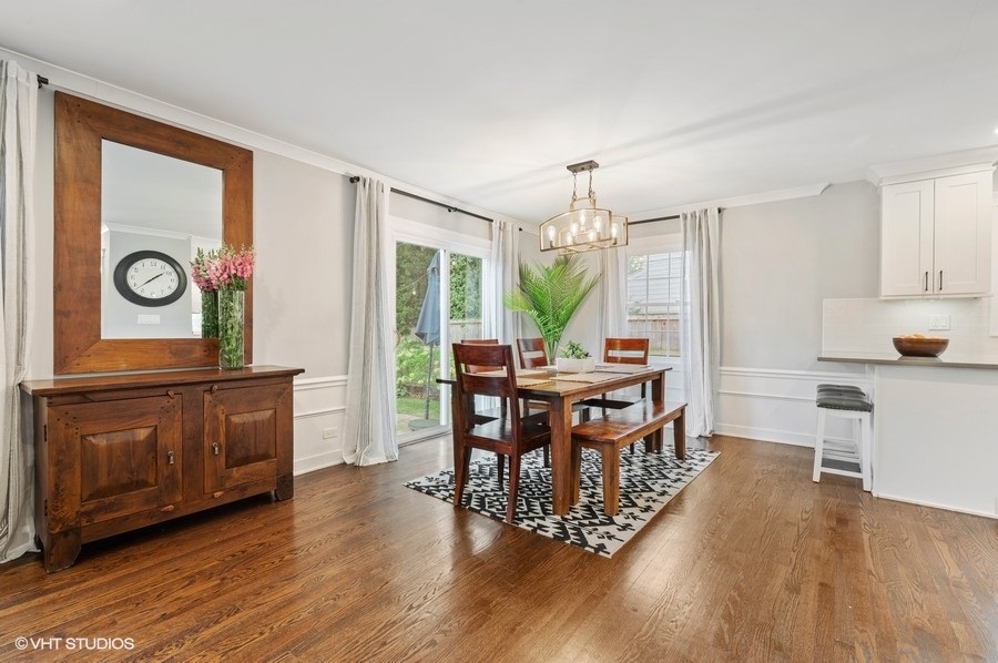 111 Riverside Drive Northfield, IL 60093 - Photo 14 of 33 a kitchen with a table and chairs in it