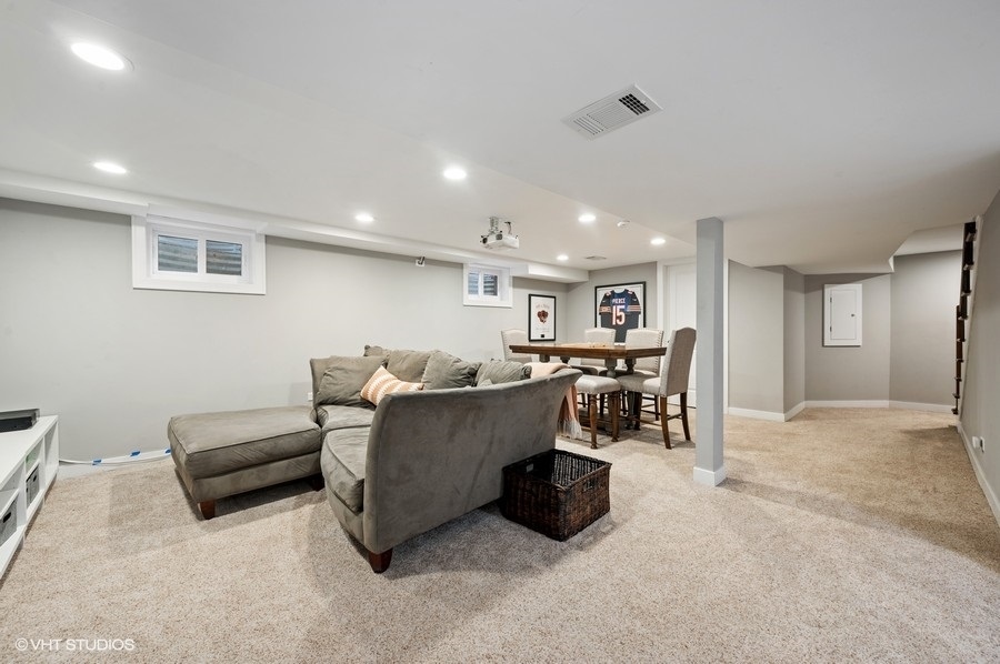 111 Riverside Drive Northfield, IL 60093 - Photo 24 of 33 a living room with furniture and a table