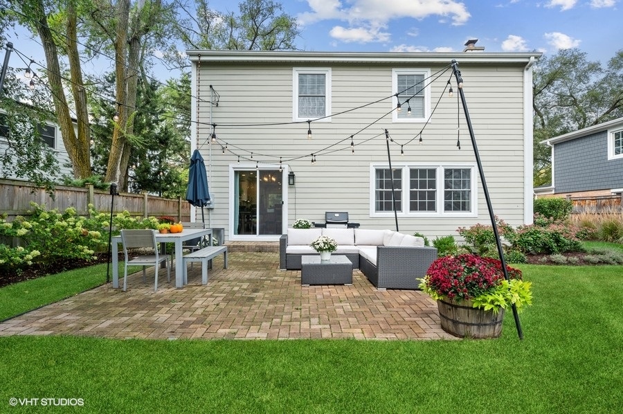 111 Riverside Drive Northfield, IL 60093 - Photo 26 of 33 a view of a house with backyard and sitting area