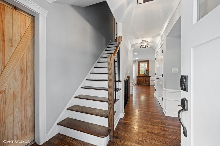111 Riverside Drive Northfield, IL 60093 - Photo 4 of 33 a view of a hallway with wooden floor and entryway