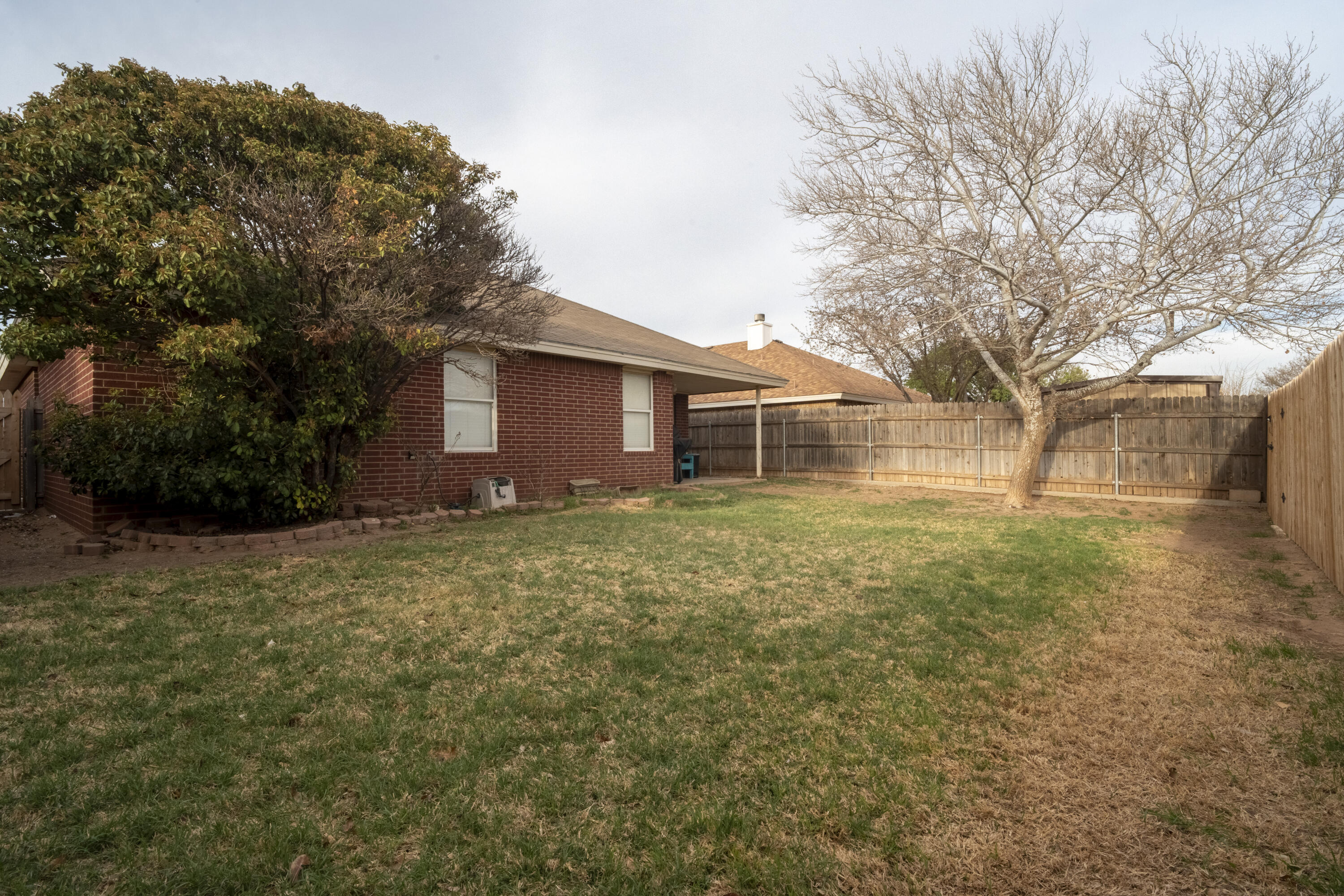 6319 13th Street Lubbock, TX 79416 - Photo 21 of 21 a backyard of a house with lots of green space