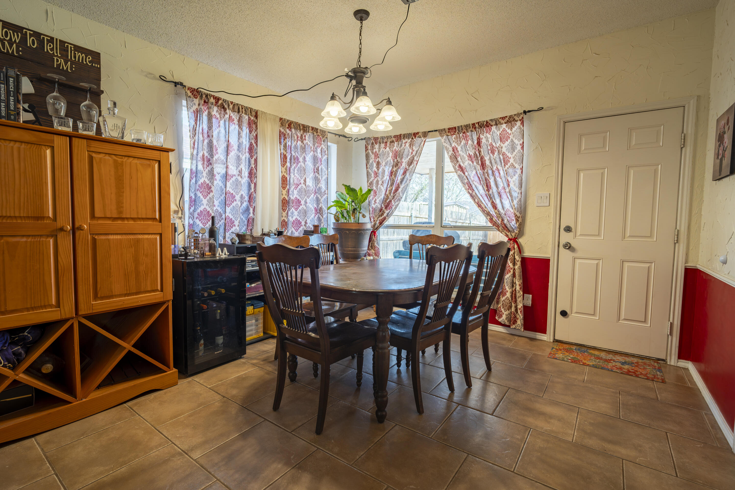 6319 13th Street Lubbock, TX 79416 - Photo 4 of 21 a view of a dining room with furniture window and outside view