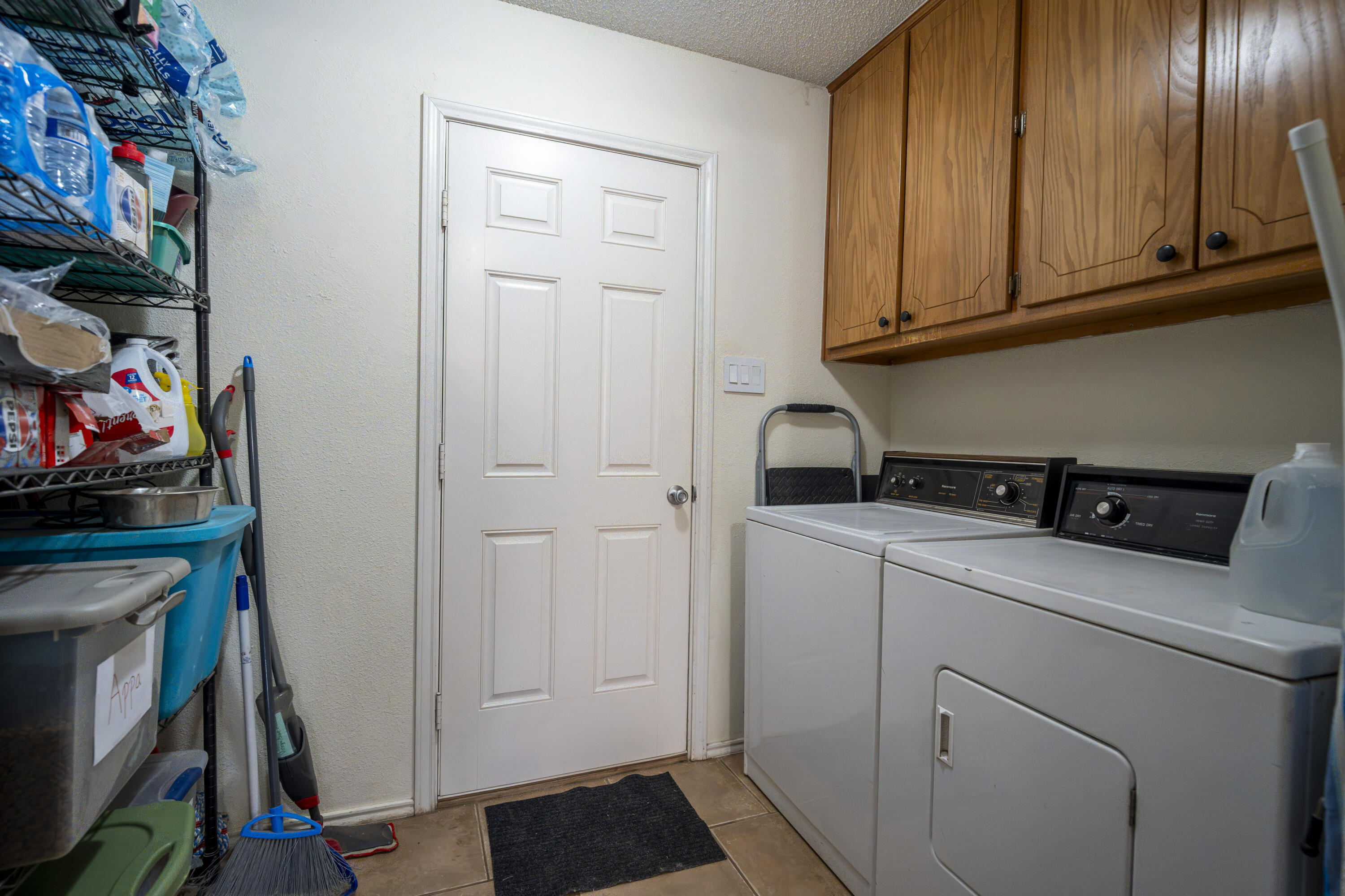6319 13th Street Lubbock, TX 79416 - Photo 7 of 21 a view of storage and utility room with washer and dryer