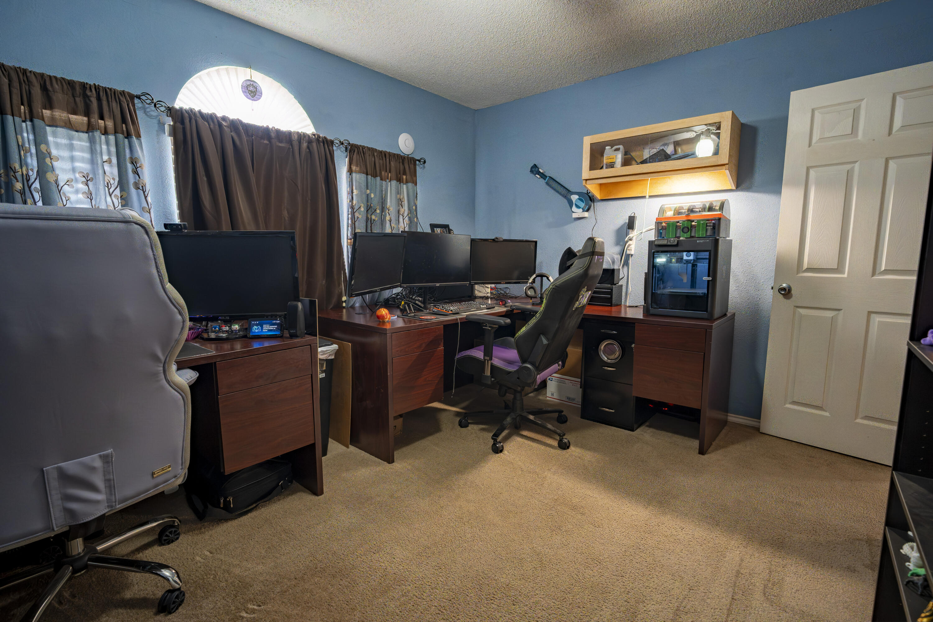 6319 13th Street Lubbock, TX 79416 - Photo 9 of 21 a view of a workspace with furniture and a window