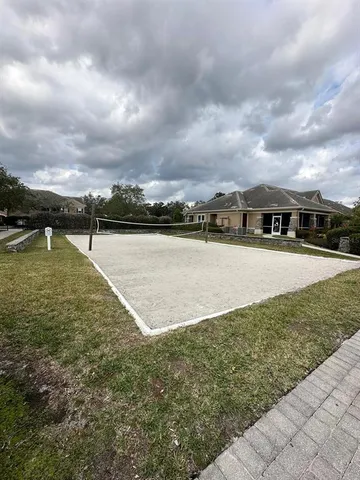 a view of a lake with houses in the back