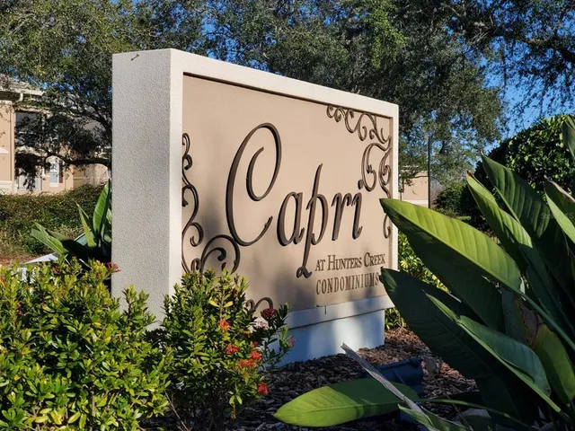 a view of a lake with houses in the background
