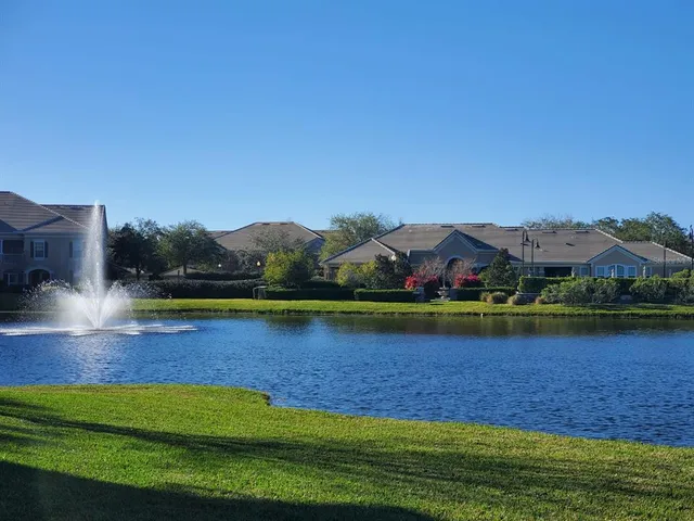 a swimming pool with outdoor seating and yard