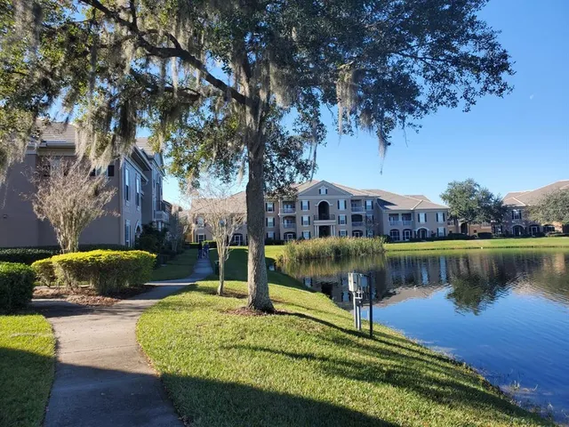 a view of a pathway with a big yard