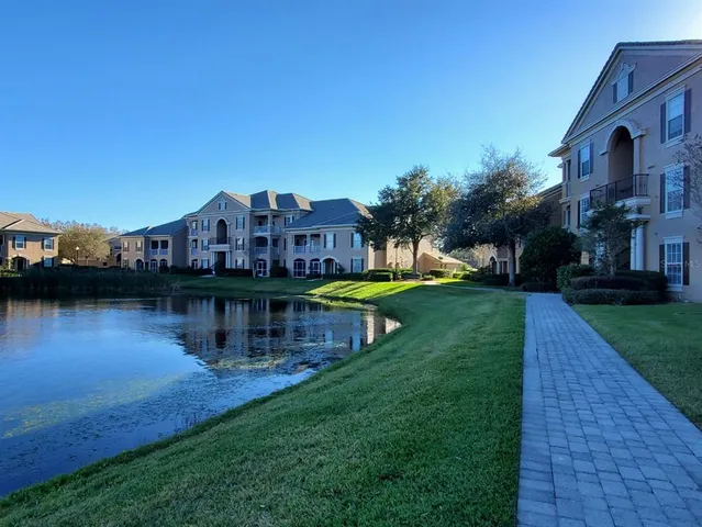a view of a lake with a house in the background