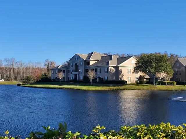 a swimming pool with outdoor seating and yard