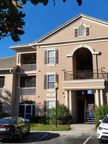 a view of a house with a window and balcony
