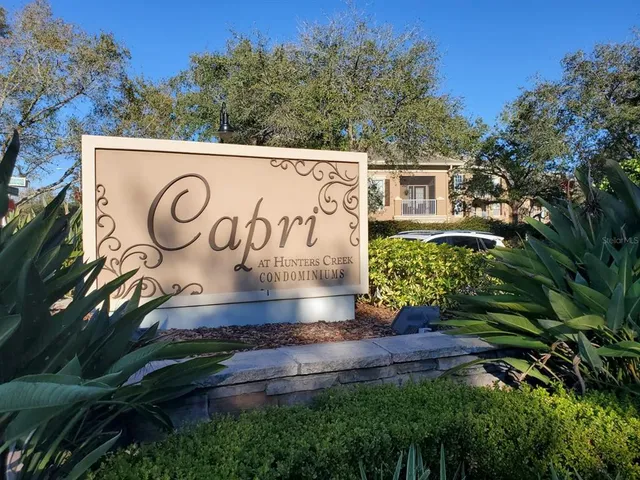 a view of sign board with green space