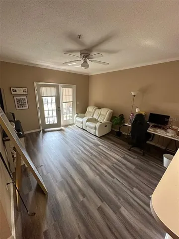 a bedroom with furniture and wooden floor