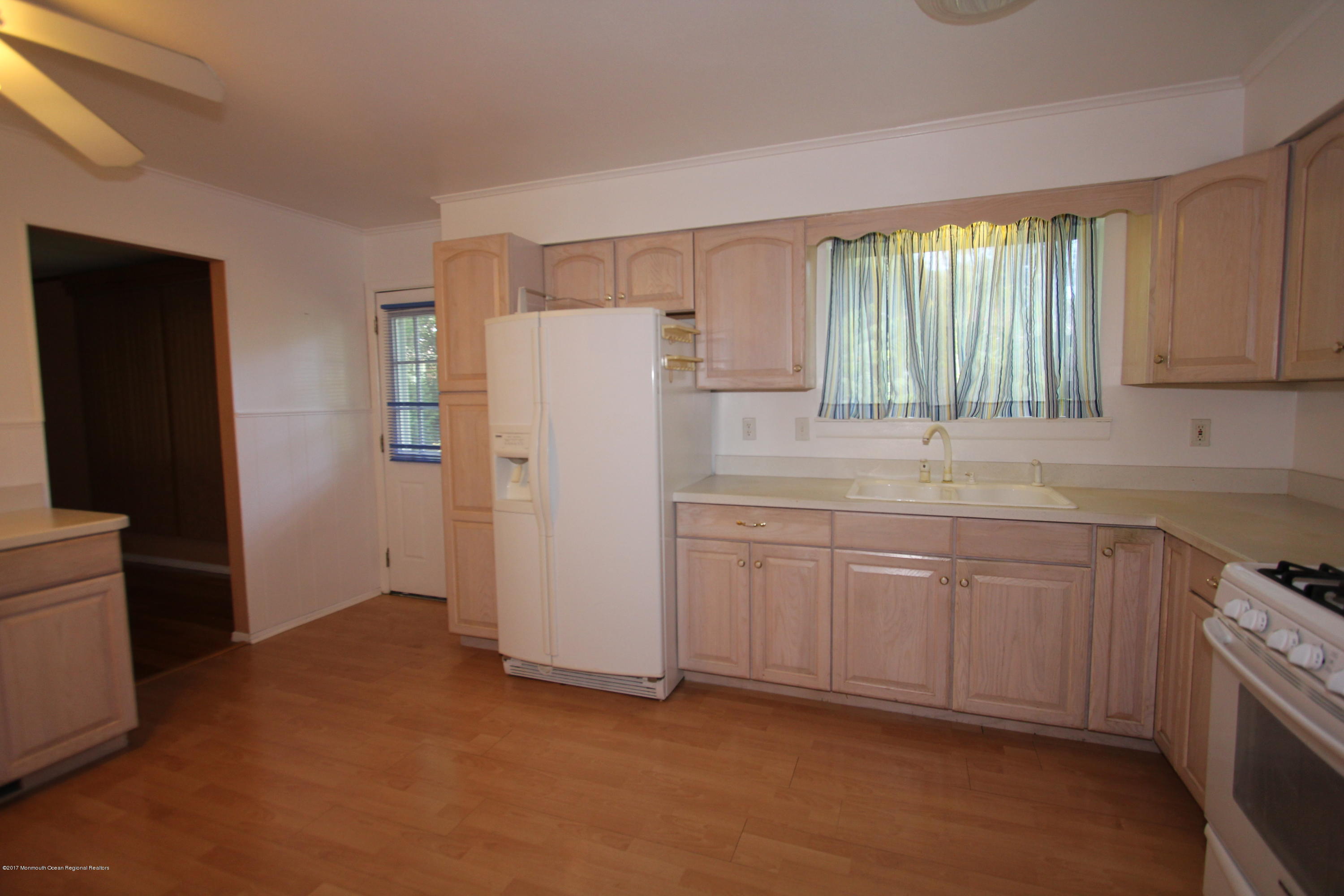 904 Fordham Road Neptune Township, NJ 07753 - Photo 11 of 24 a kitchen with refrigerator and window