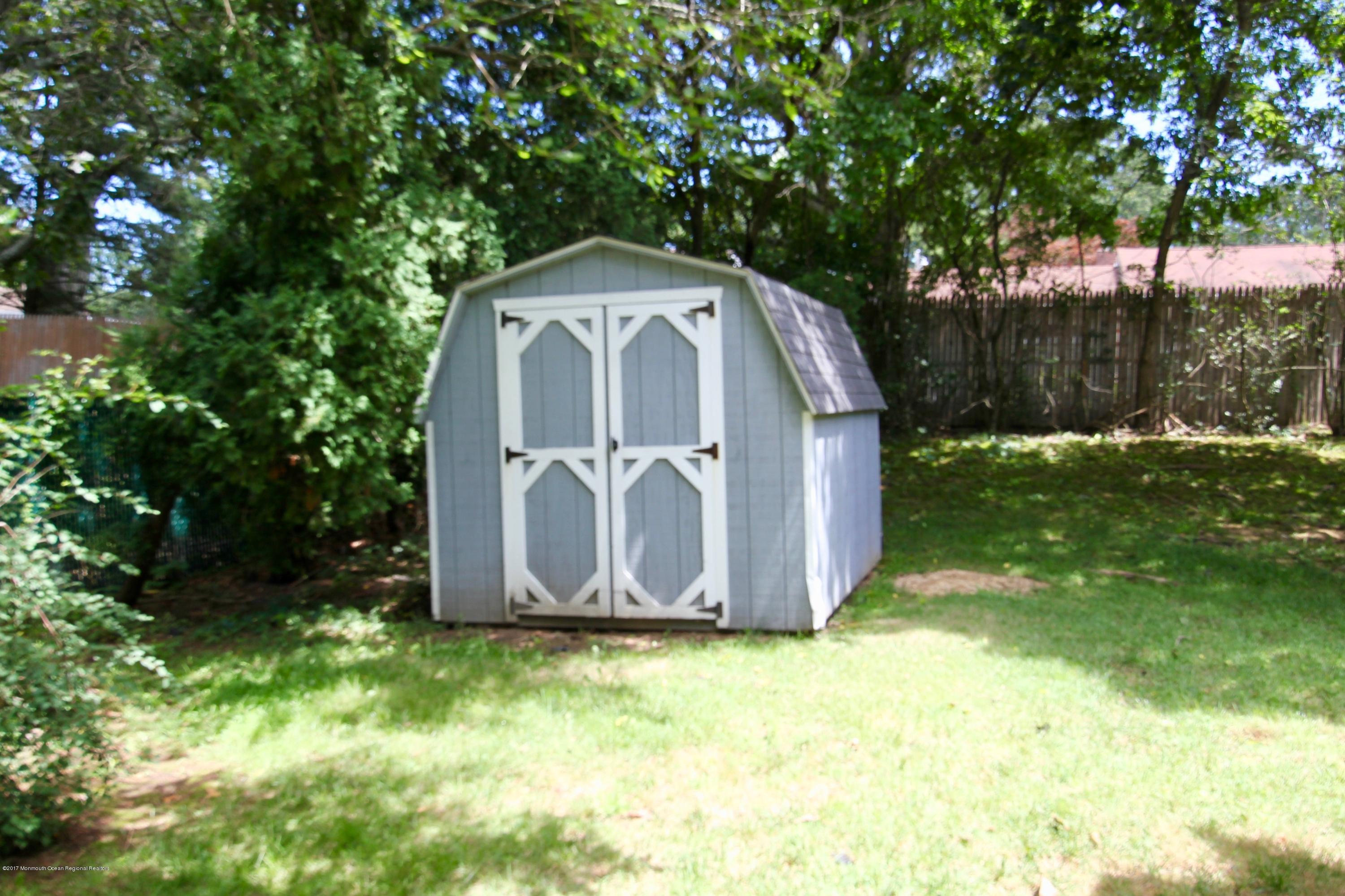 904 Fordham Road Neptune Township, NJ 07753 - Photo 13 of 24 a view of a tiny house with a yard