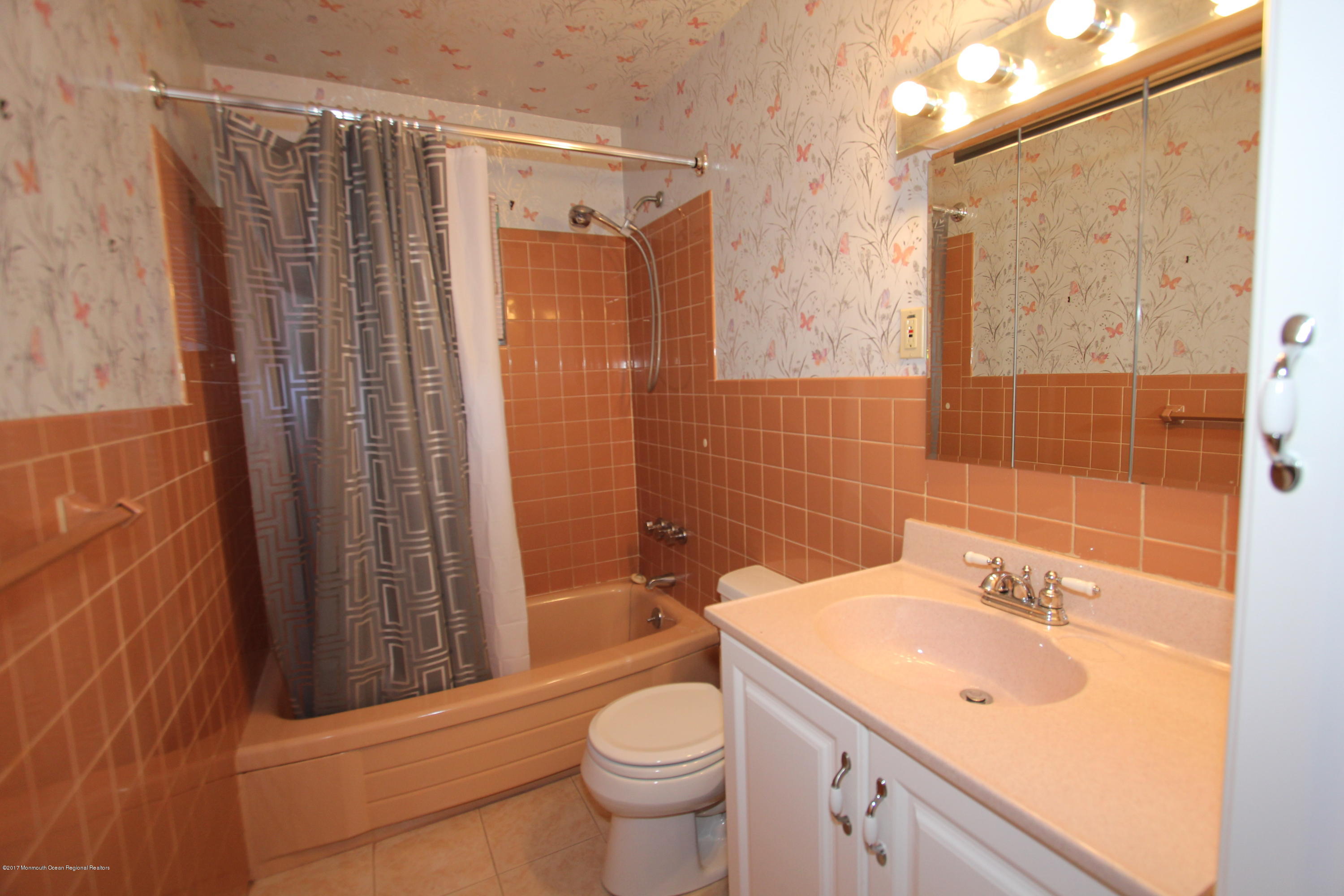 904 Fordham Road Neptune Township, NJ 07753 - Photo 15 of 24 a bathroom with a sink a toilet and shower