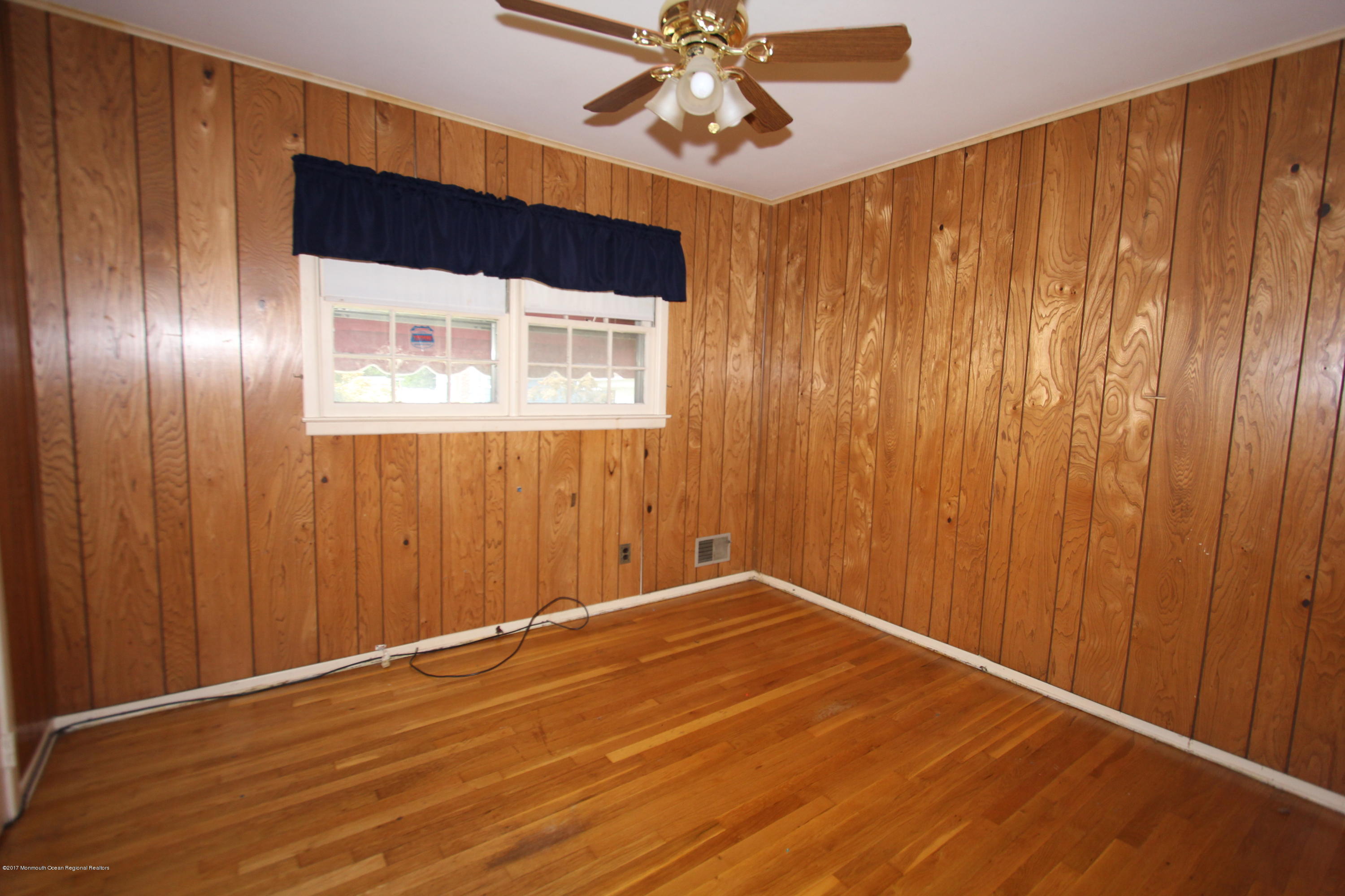 904 Fordham Road Neptune Township, NJ 07753 - Photo 20 of 24 a view of a room with wooden floor