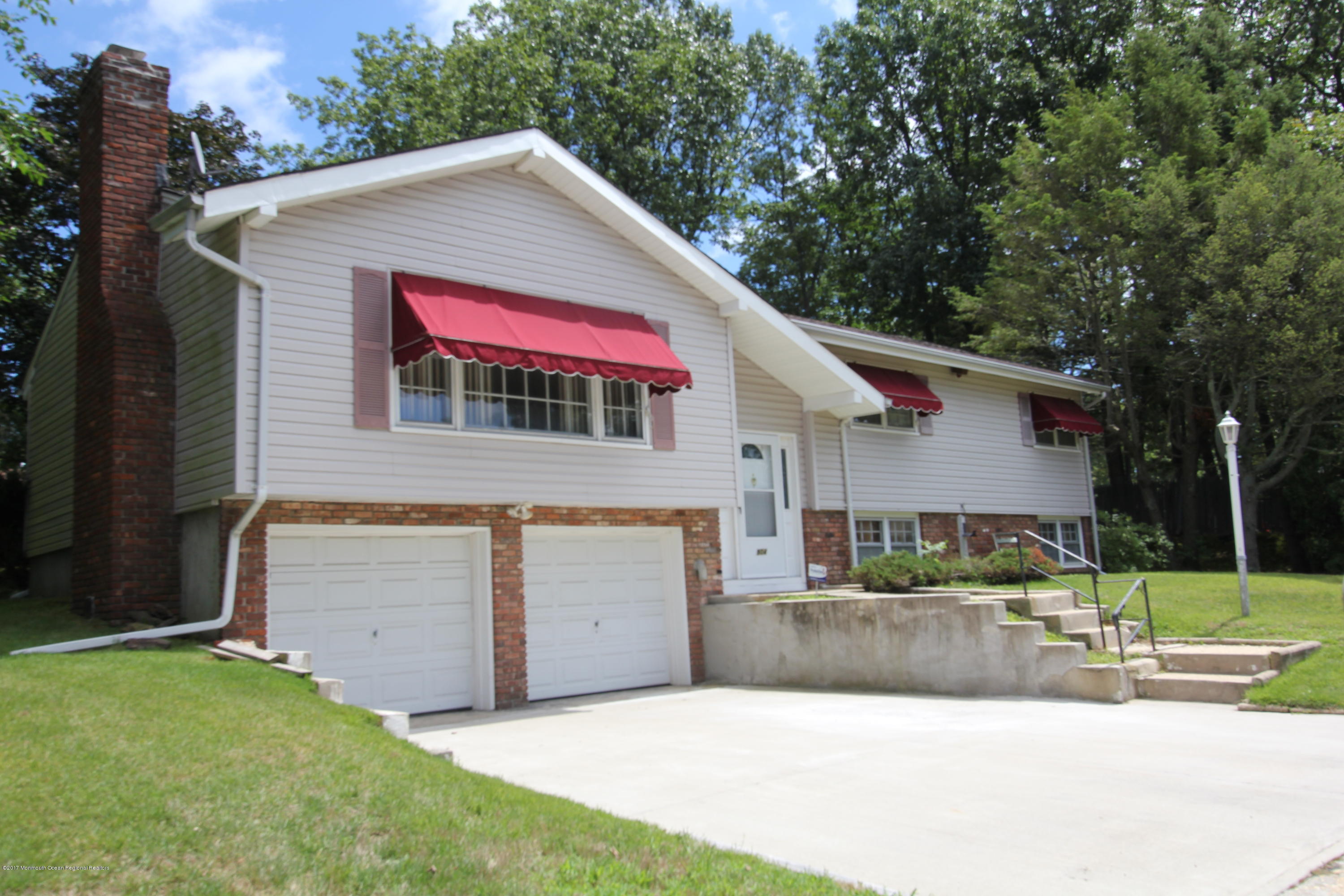 904 Fordham Road Neptune Township, NJ 07753 - Photo 2 of 24 a view of a house with backyard and trees